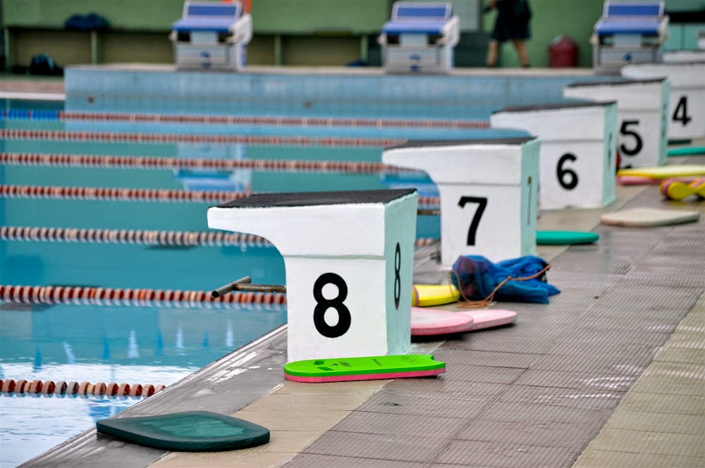 Numbered starting blocks at sports swimming pool